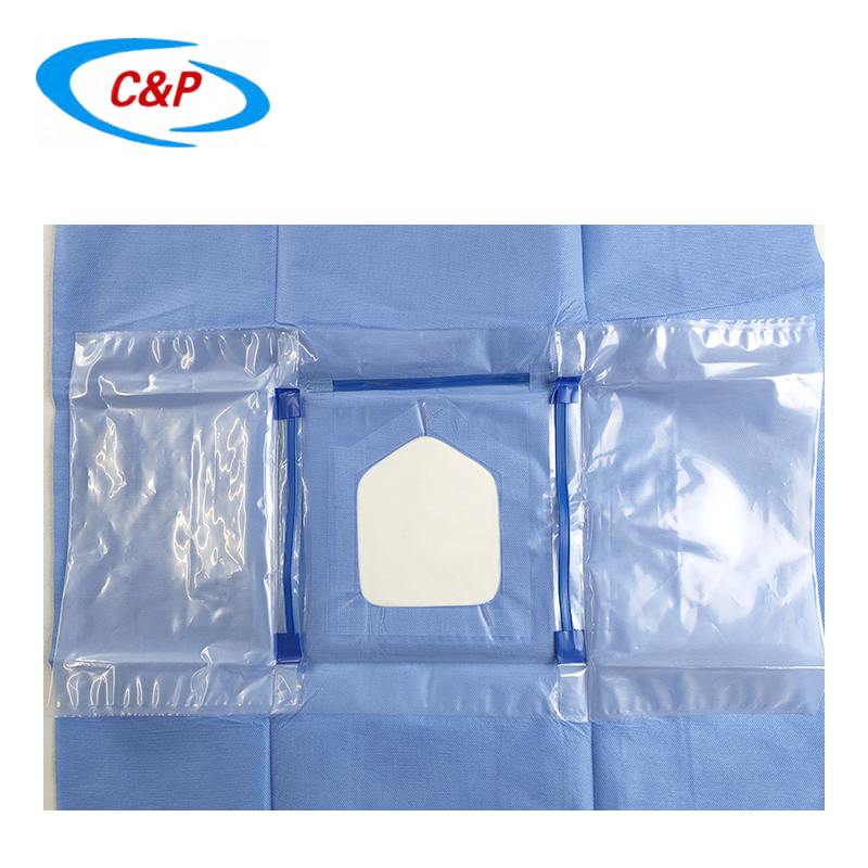 Ophthalmic drape with adhesive